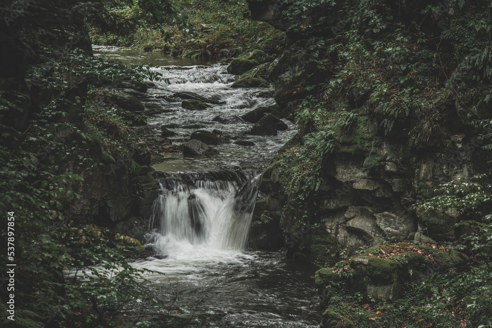 Fototapeta premium Mountain waterfall during fall