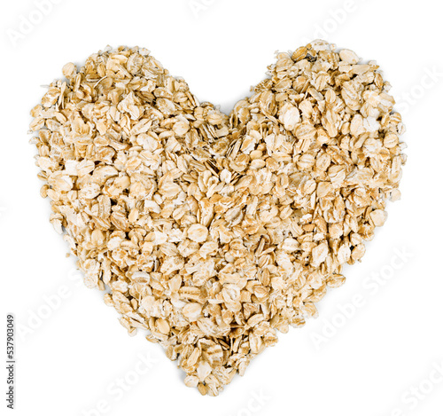 heap of oat flakes in a shape of heart shot from above