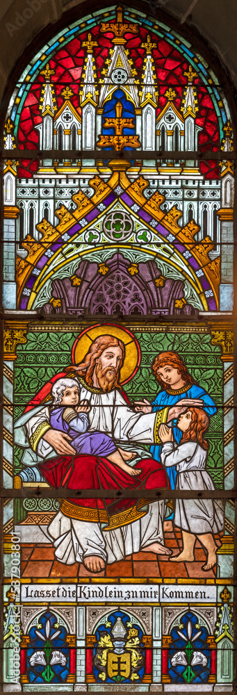 ZURICH, SWITZERLAND - JUNE 27, 2022: The Jesus among the children in St. Peter und Paul church by Albin Schweri (1885 - 1946).