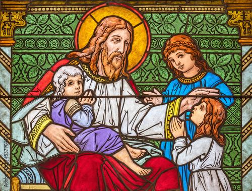 ZURICH, SWITZERLAND - JUNE 27, 2022: The Jesus among the children in St. Peter und Paul church by Albin Schweri (1885 - 1946).