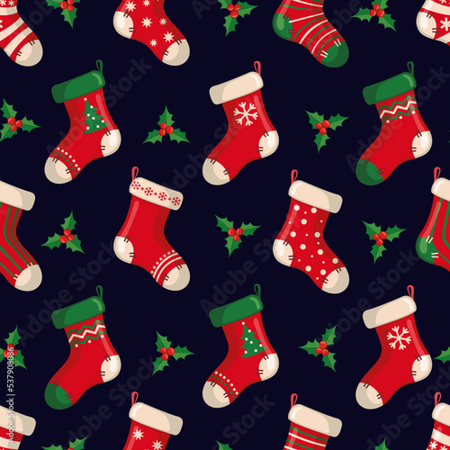 Cute seamless pattern with red socks in flat style for Christmas and New Year holiday.