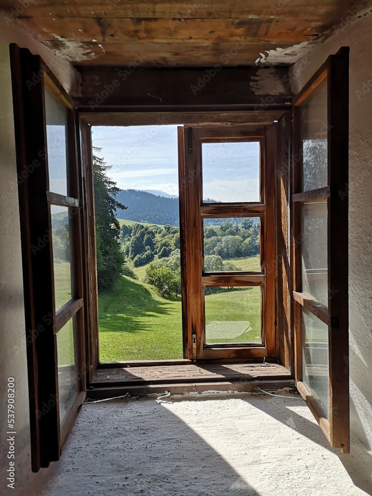 Fototapeta premium fairytale view from old wooden window, slovakian countryside 