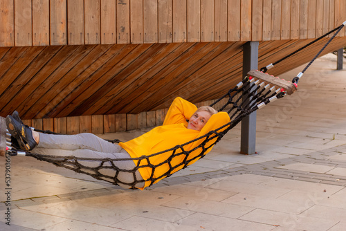 senior aged woman in a hammock outdoor