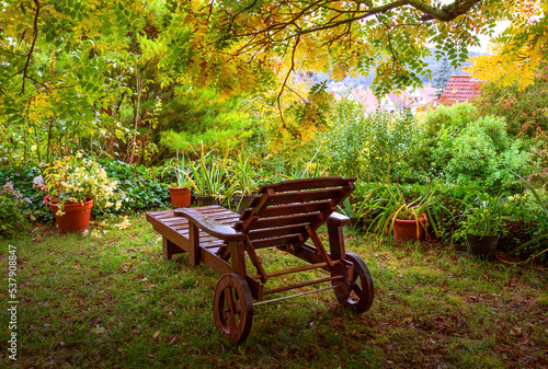 wooden lounger for relaxing in the autumn garden