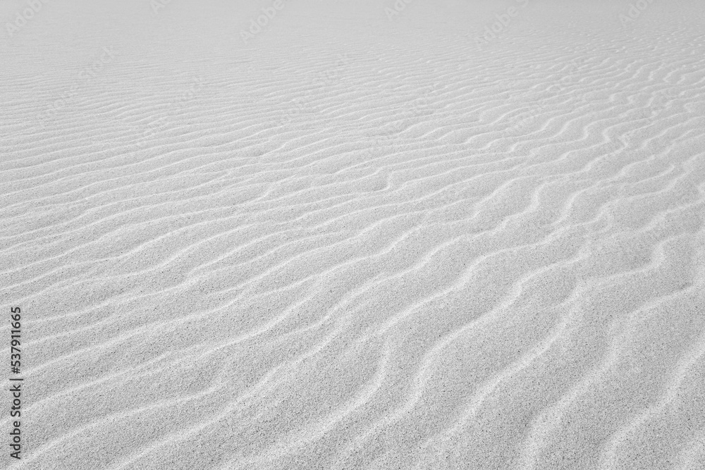 Close up on Beach Sand texture background for wallpaper and poster. Sandy beach. Side Top view. Close up on Beach Sand texture background for wallpaper and poster. Sandy beach. Side Top view.