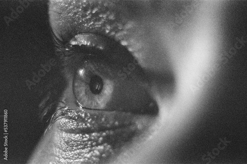 Looking Eye Grainy Black-White Film Close-Up photo