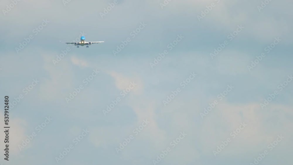Shot of jet airplane approaching before landing at Airport of Amsterdam. Aviation and travel concept Shot of jet airplane approaching before landing at Airport of Amsterdam. Aviation and travel concept
