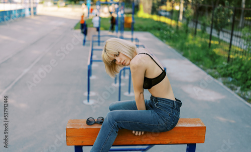 blond young woman on the sport ground 
