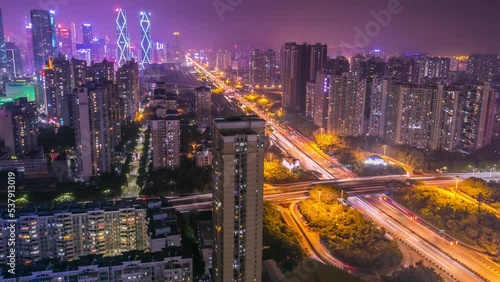 Wallpaper Mural Traffic on controlled-access highway in large Chinese city downtown at night. Illuminated motorway two-level interchange. Upper view time lapse Torontodigital.ca