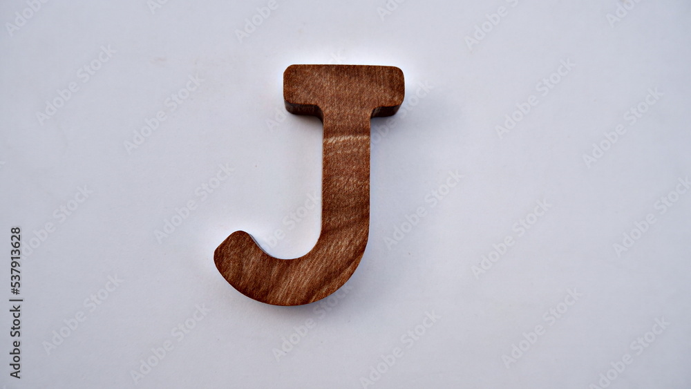 Wooden textured alphabet letters on a white background , selected focus isolated photo Wooden textured alphabet letters on a white background , selected focus isolated photo