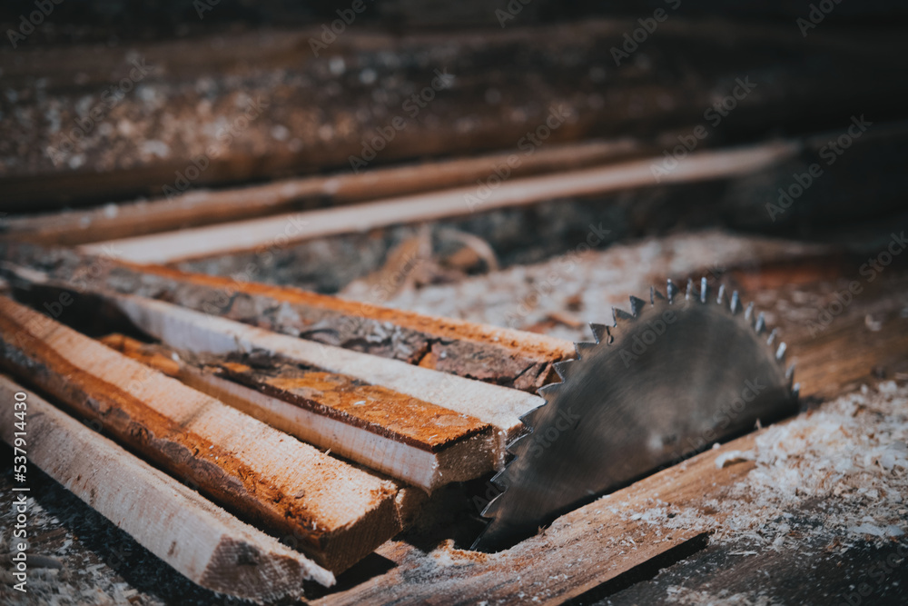 A close-up picture of a rusty circular saw in an old sawmill A close-up picture of a rusty circular saw in an old sawmill