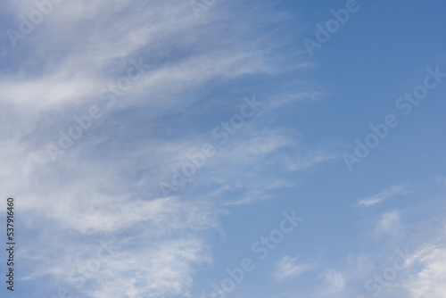 Blue Summer Sky Background with light cumulous clouds