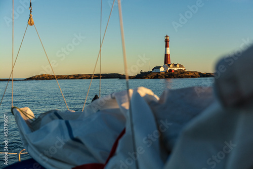 Færder lighthouse on the coast of Norway, seen from a sailboat photo