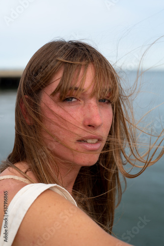 Gen z portrait wind blowing hair and fringe photo