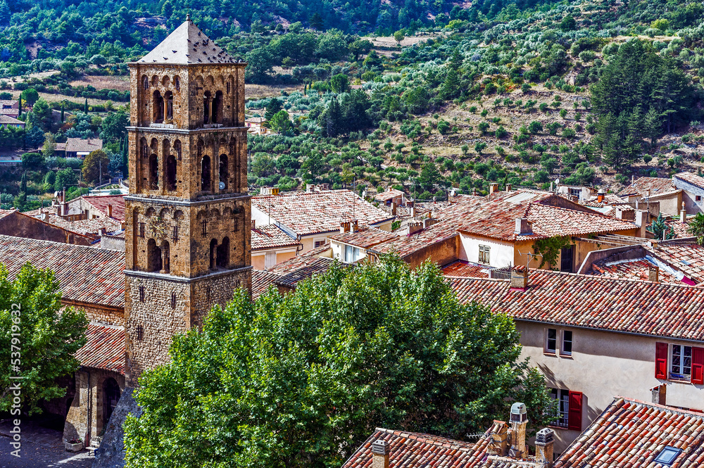 France. Regional Natural Park of Verdon. Moustiers-Sainte-Marie. View of the red roofs of the old village and the campanile