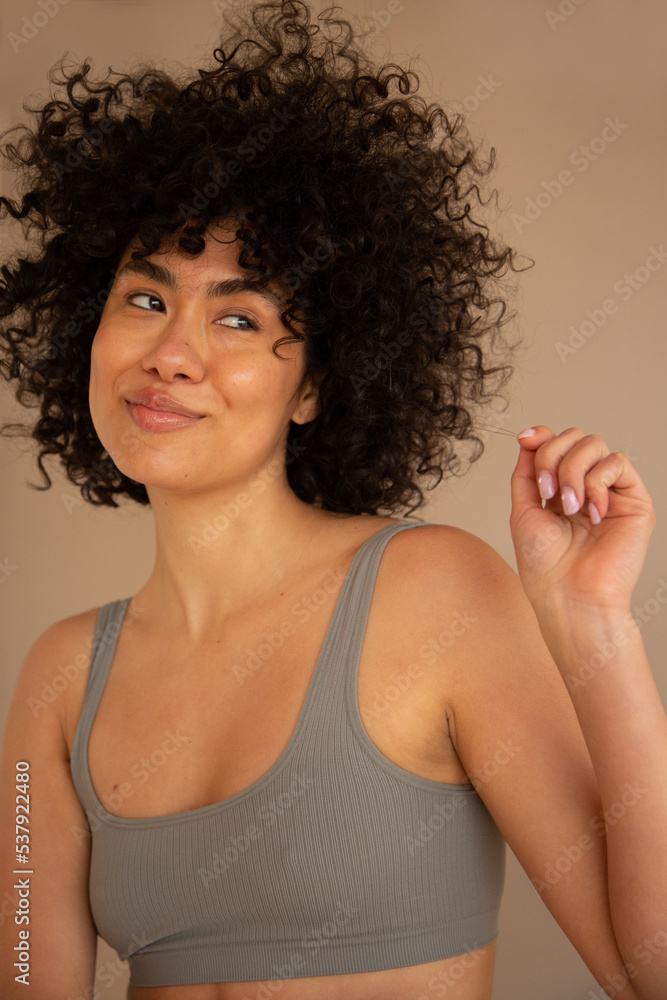 Woman looking to the side playfully Woman looking to the side playfully