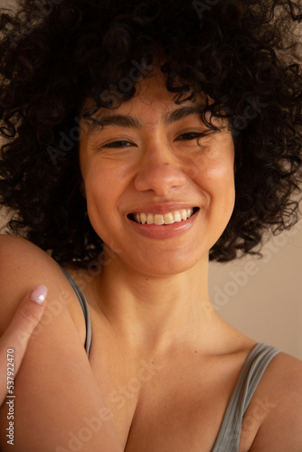 Woman with dewy skin smiling