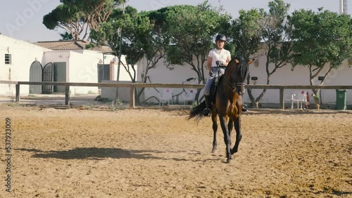 4K videos of a young rider taming a horse and making it dance