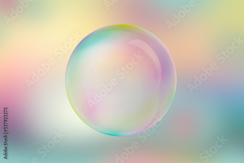 Iridescent soap bubble on multicolored background.