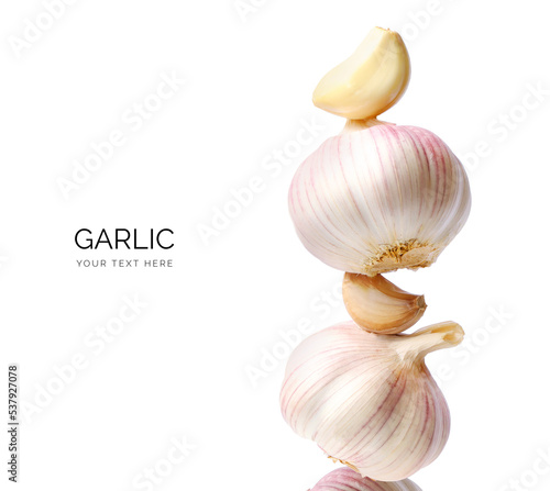 Creative layout made of garlic on the white background. Flat lay. Food concept. Macro concept.  photo