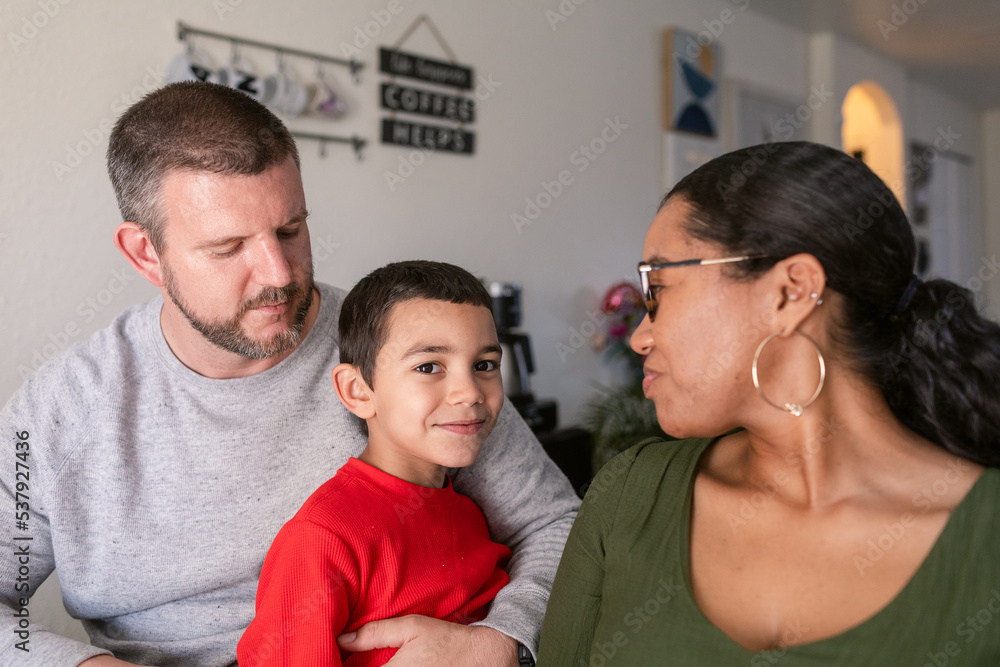 Parents with their young son at dining table Parents with their young son at dining table