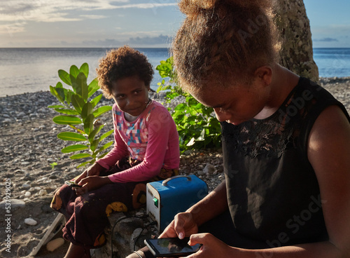 Renewable energy phone charging - portable solar cell panel, Pacific photo