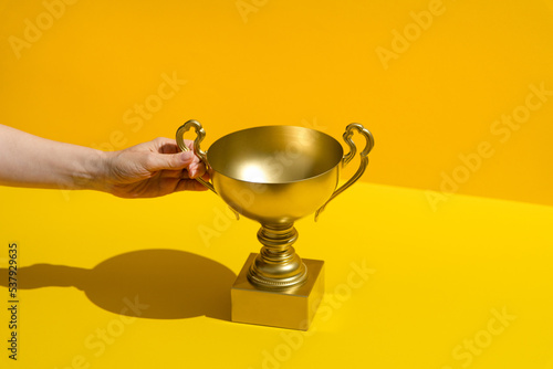 First place golden cup. Success and achievement, victory concept.