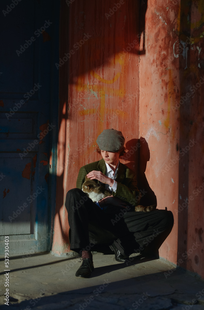 young man holding a cat young man holding a cat