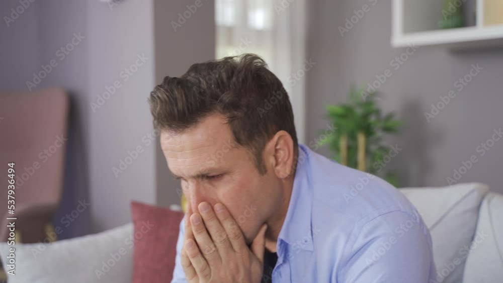 Sad man alone at home.
Sad man sitting at home and looking around thoughtful and sad.
Sad man alone at home.
Sad man sitting at home and looking around thoughtful and sad.