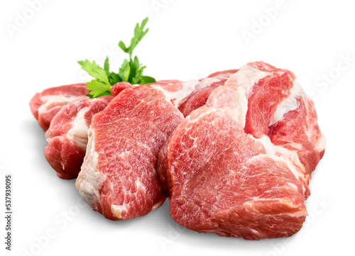 Pieces of crude meat with parsley photo