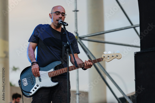 Bassist guitarist on stage photo