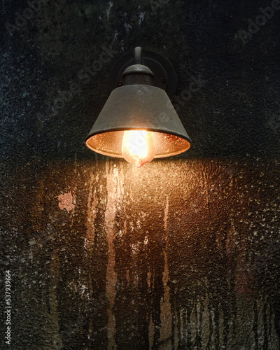 Old Light Hanging on Scary Wall