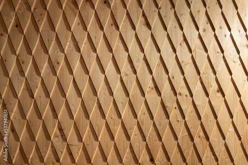 Closeup view at timber wall with many geometric parts photo