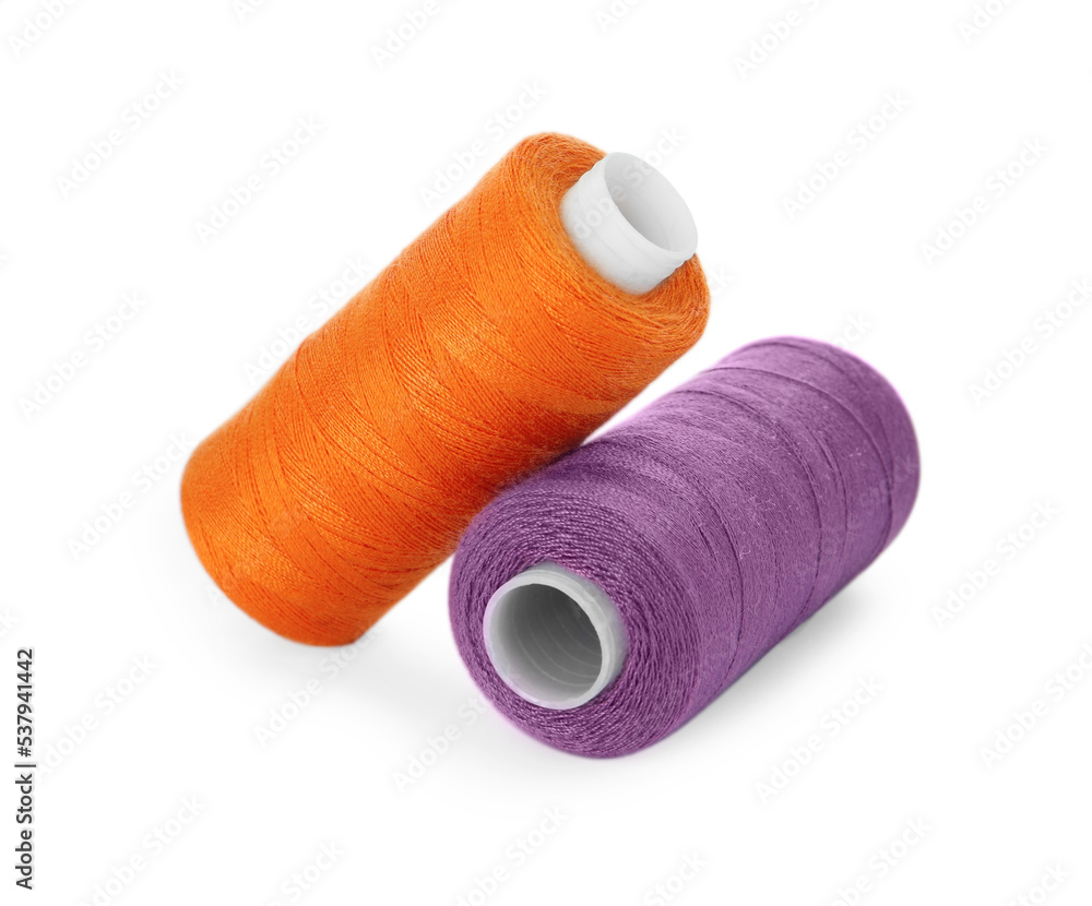 Different colorful sewing threads on white background Different colorful sewing threads on white background