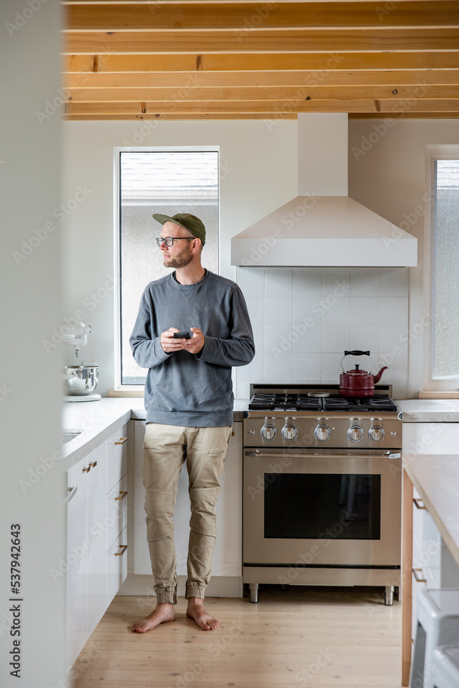 Male On Phone In Kitchen Male On Phone In Kitchen