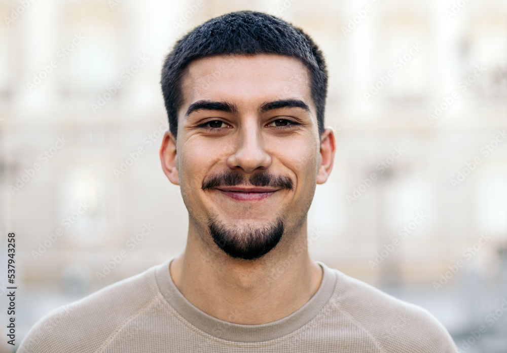 Portrait of a young man with a goatee and mustache Portrait of a young man with a goatee and mustache