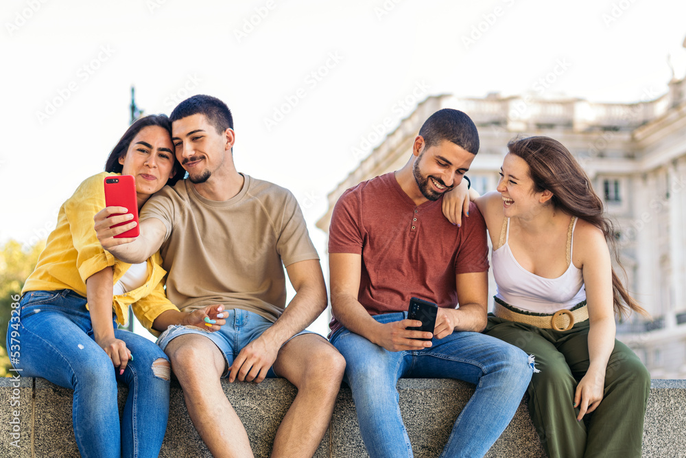 Young friends taking selfies with smartphone in the city Young friends taking selfies with smartphone in the city