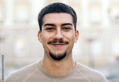 Portrait of a young man with a goatee and mustache photo