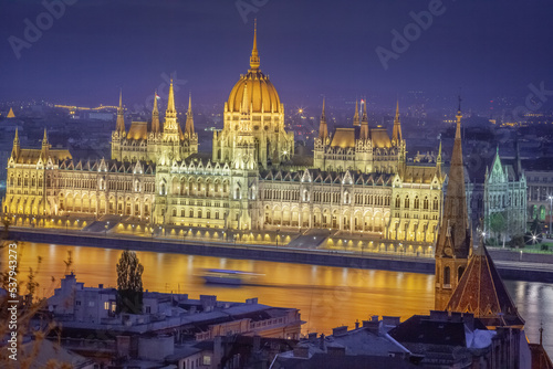 Parliament illuminated and Danube River at dramatic evening, Budapest, Hungary