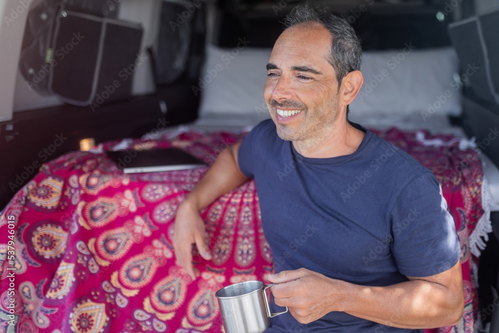 young man in camper van young man in camper van