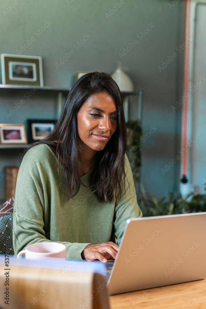 Hispanic woman freelancer working at small business Hispanic woman freelancer working at small business