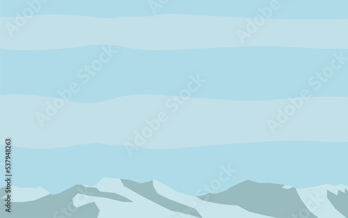 mountains with light blue sky and thin clouds