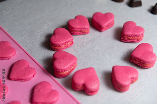 Red Heart Macarons Dessert on Baking Parchment Paper