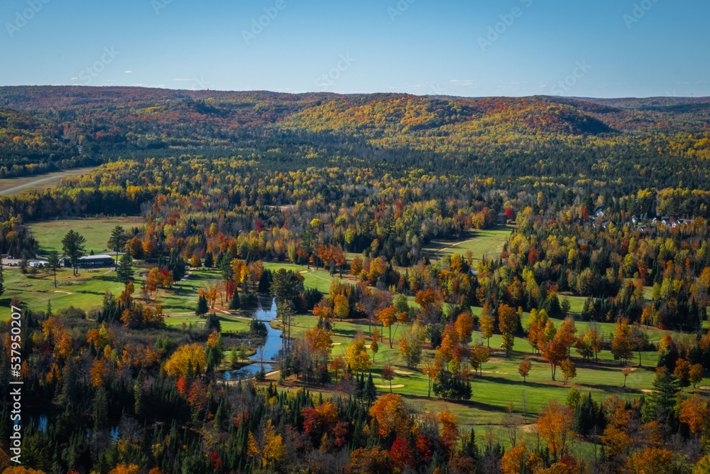 Bird's eye view lookout over fall color trees and golf course in Bancroft, Ontario, Canada