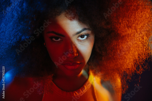 African American model under bright light photo