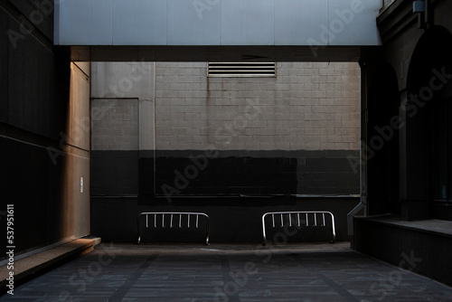 An empty bike rack in the city.