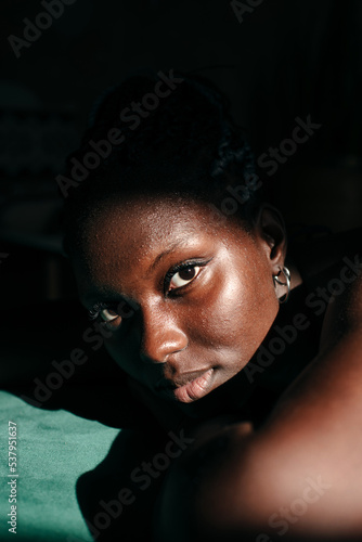 Portrait of a black woman with pimples and natural skin photo