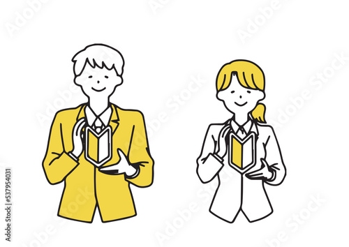 初心者マークを持っているビジネスマンの男女