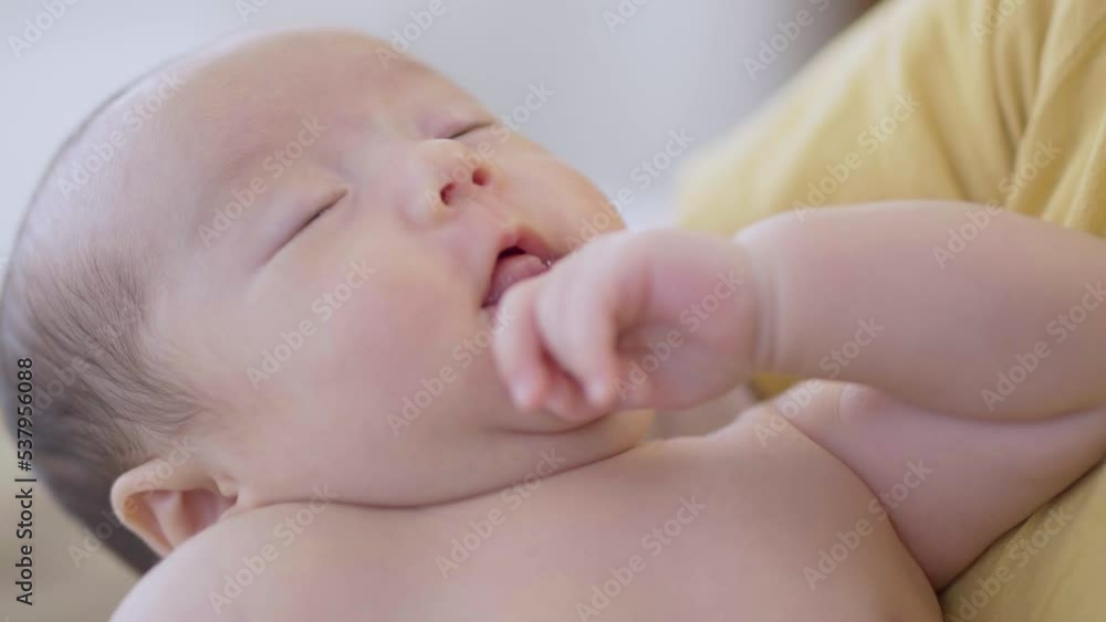 Selective focus Asian toddler newborn sleep in mother arm embracing gentle, comfortable, safe. Close up Mom hold infant with love, care, tenderly at home, new mom motherhood nurturing concept
Selective focus Asian toddler newborn sleep in mother arm embracing gentle, comfortable, safe. Close up Mom hold infant with love, care, tenderly at home, new mom motherhood nurturing concept