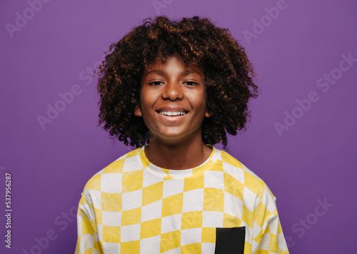 Cheerful black child with curly hair